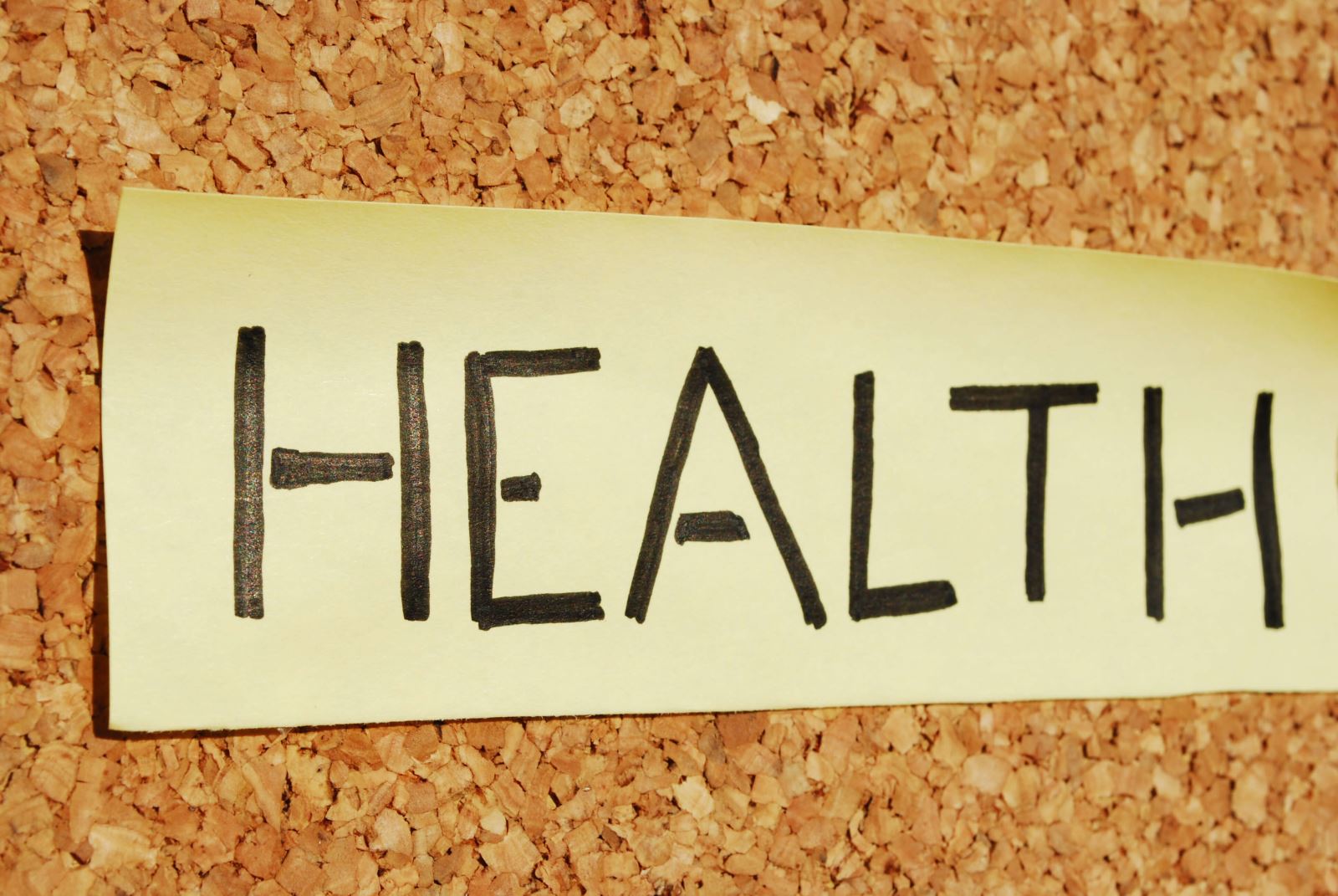 Stock photo with text "Health" written on a post-it note. 