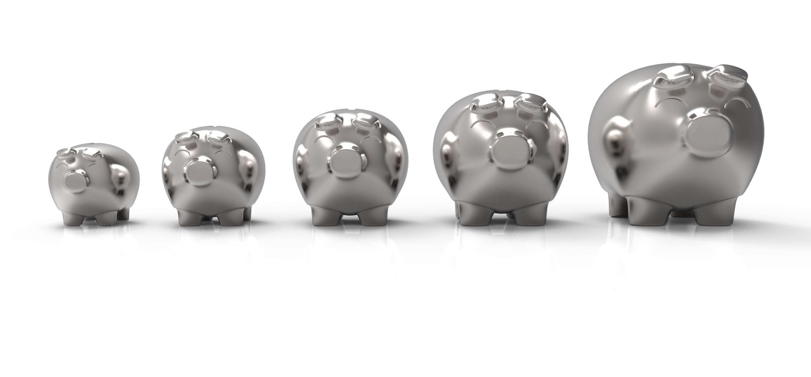 Stock image of silver piggy banks from smaller to a large one